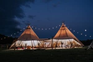 2 Tipis lit up and looking welcoming